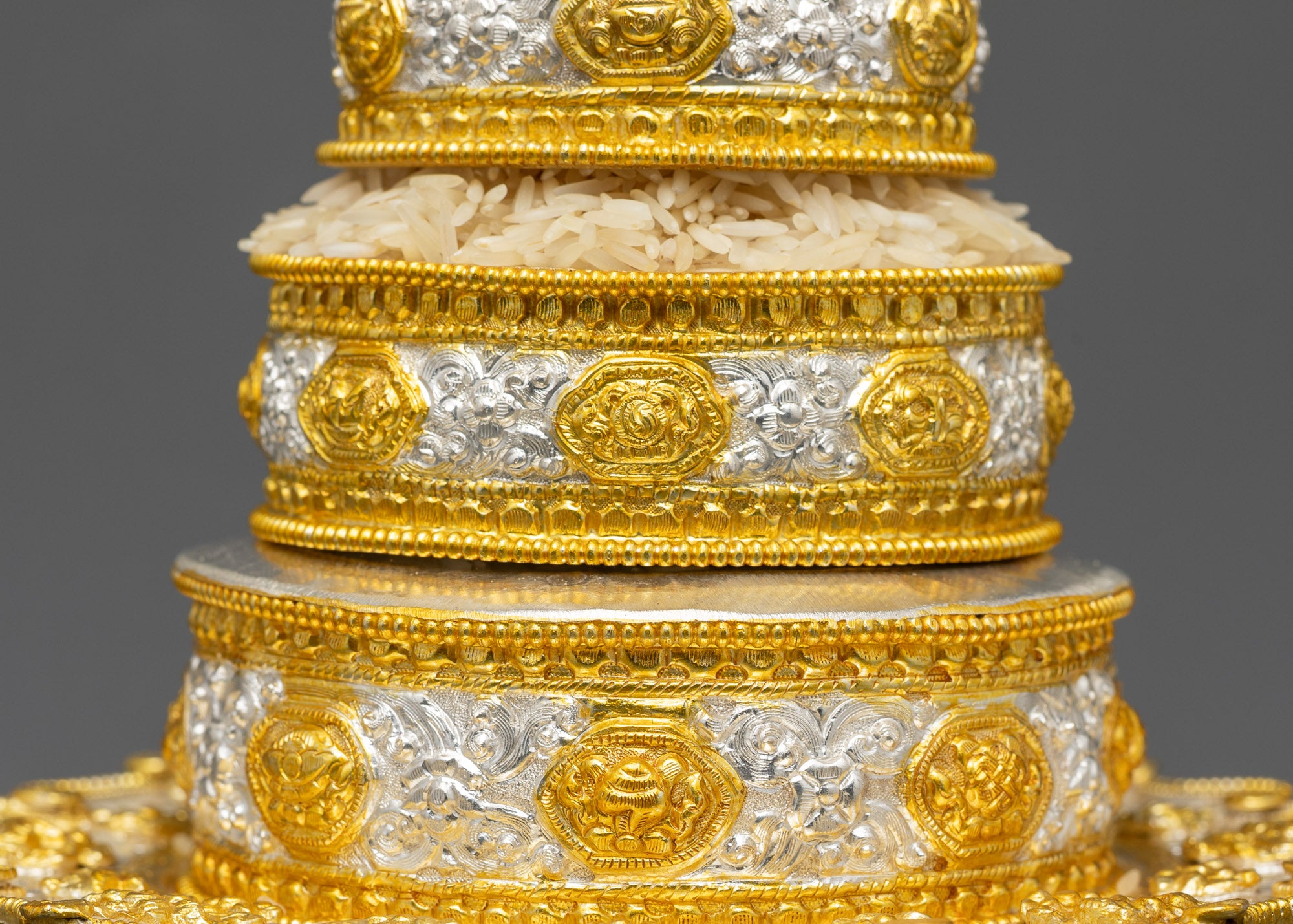 Back view of handcrafted Tibetan Mandala topped with wisdom wheel for meditation