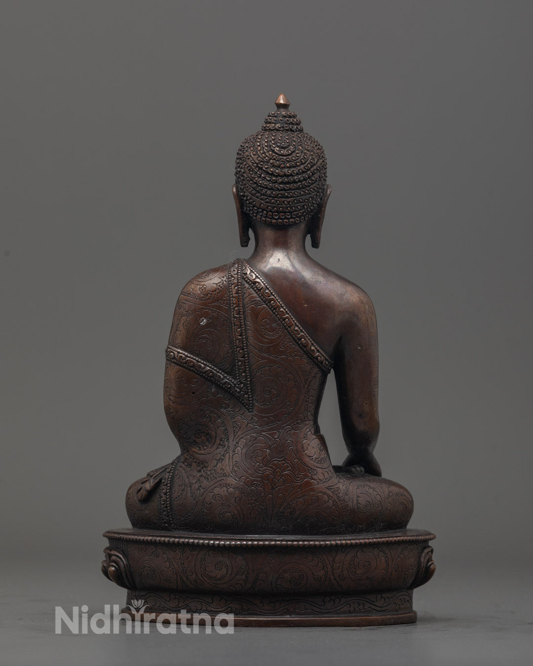 Back view of intricately carved Oxidized Shakyamuni Buddha Sculpture by Nepalese artisan
