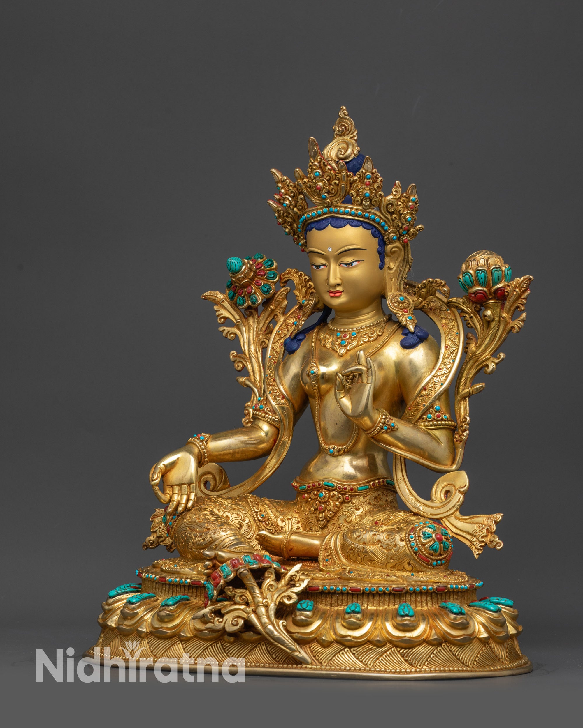 Back view of lotus seat with dual deer and dharmachakra carvings on Green Tara statue