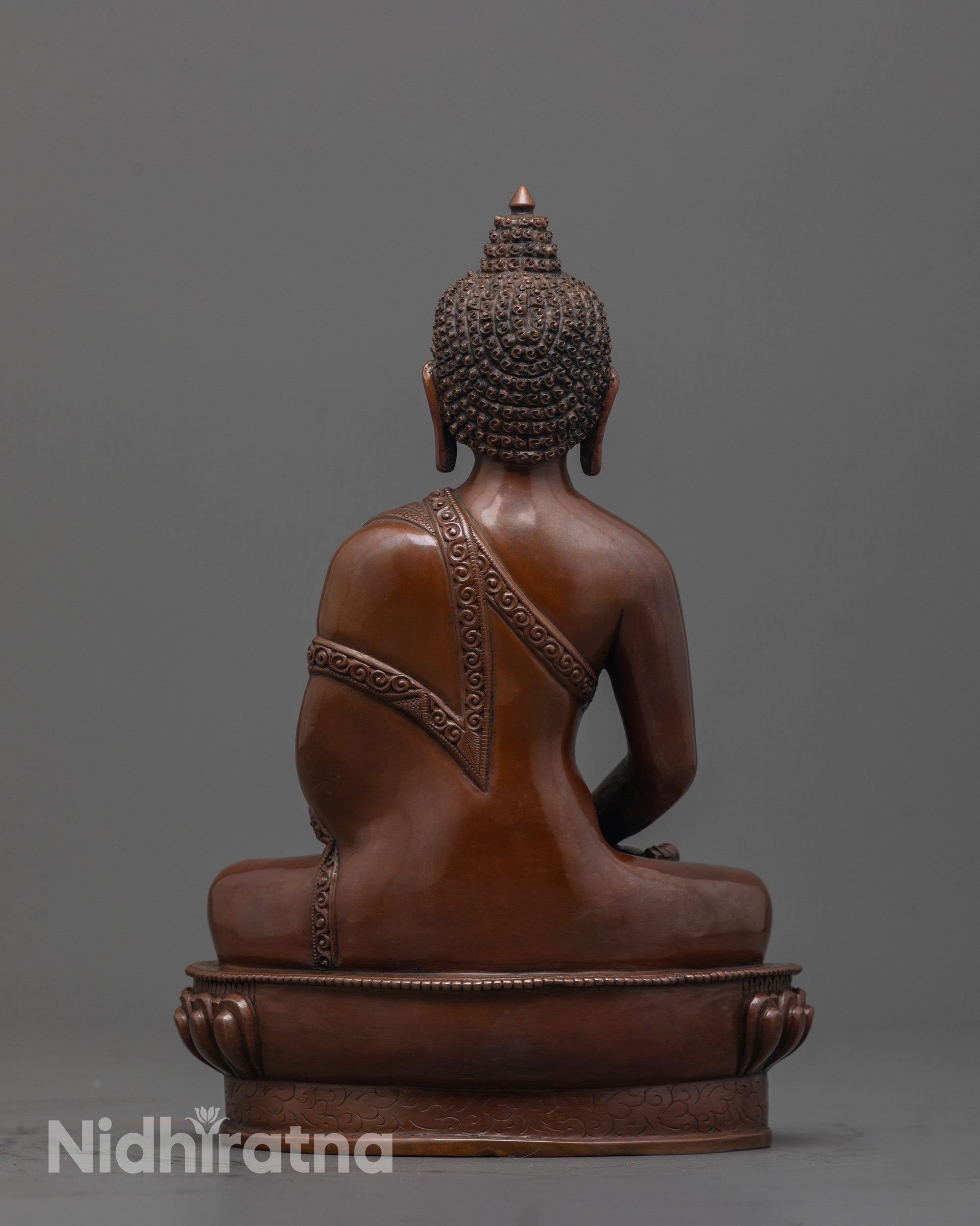 Back view of oxidized Amitabha Buddha with traditional monk’s robe detailing
