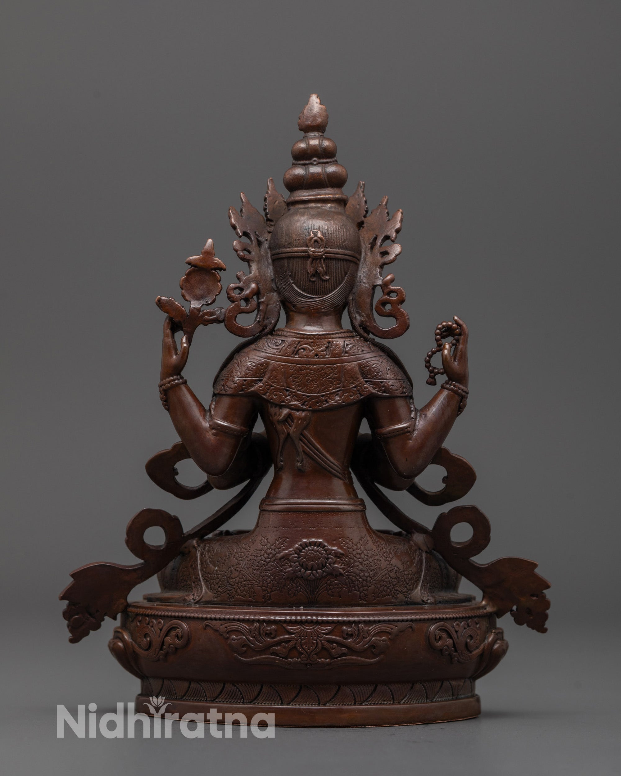 Back view of oxidized Chenrezig statue showing uniform electroplated finish and mantra hollow
