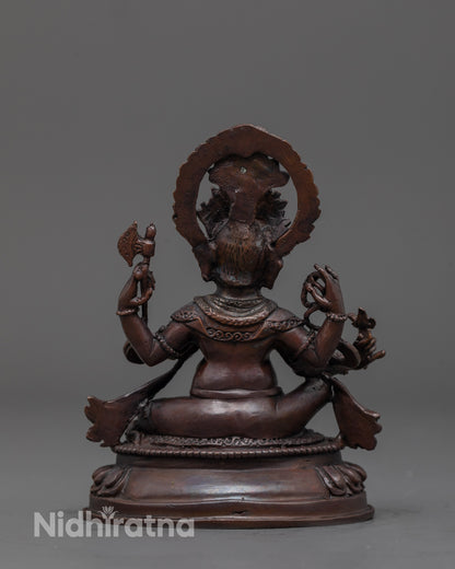 Back view of oxidized Ganesha statue showing fine detailing and copper finish