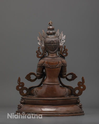 Back view of oxidized Vajradhara statue showing lotus base and fine artisan craftsmanship