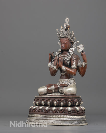 Back view of oxidized copper Chenrezig statue highlighting silver-plated garments and texture