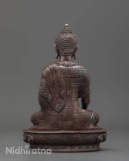 Back view of oxidized copper Gautama Buddha sculpture highlighting detailed craftsmanship
