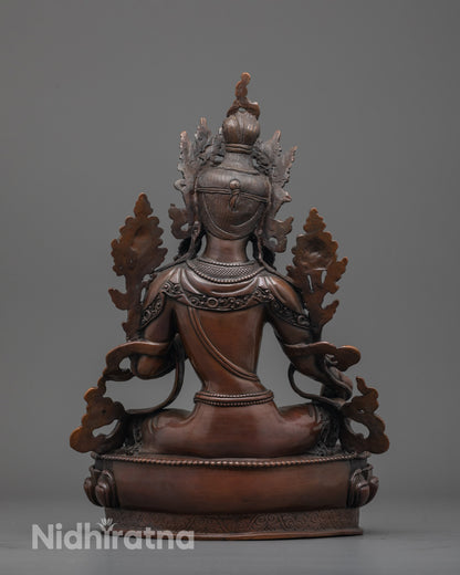 Back view of oxidized copper Green Tara statue showing detailed patterned robe craftsmanship.