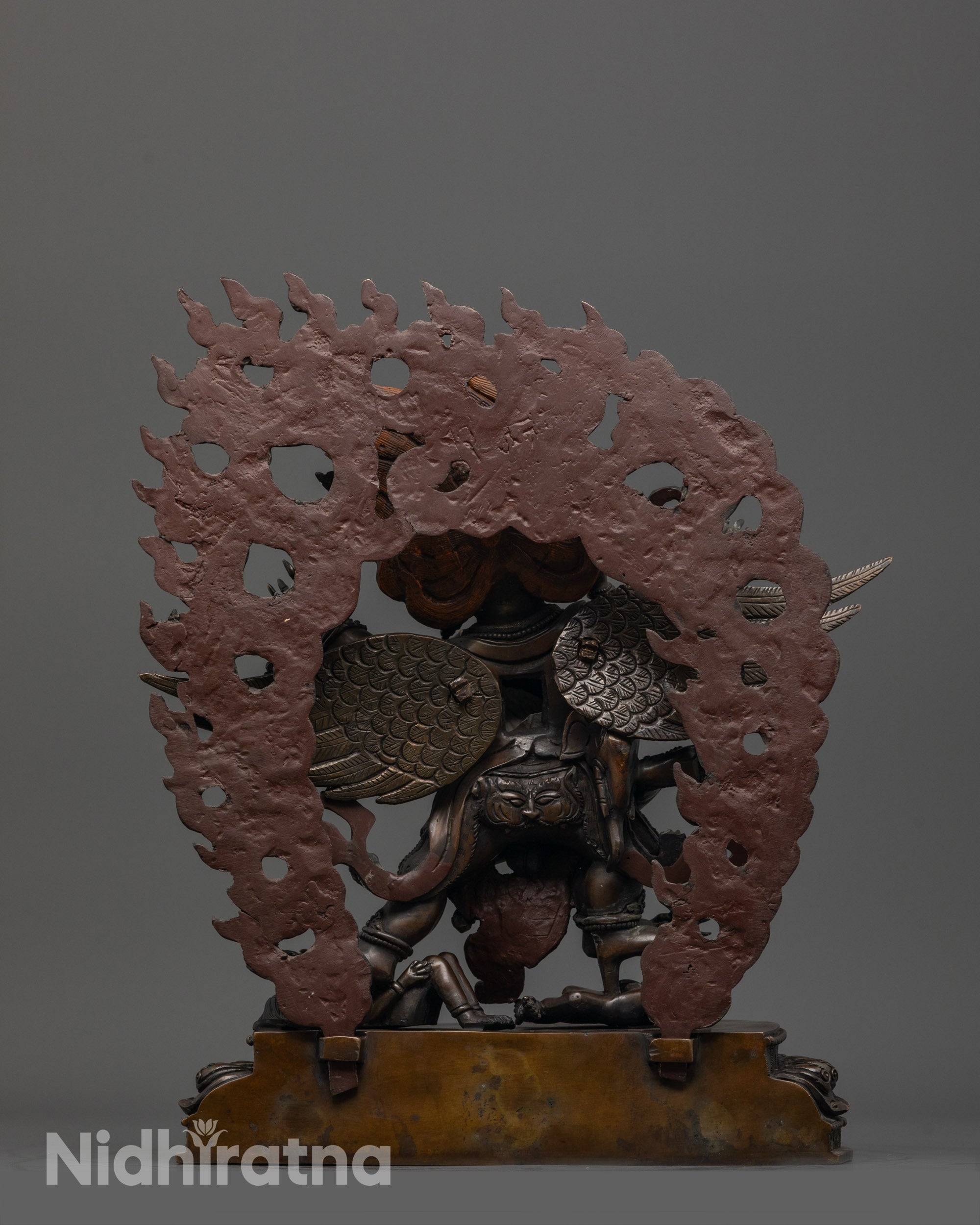 Back view of oxidized copper Hayagriva statue showing elaborate patterns
