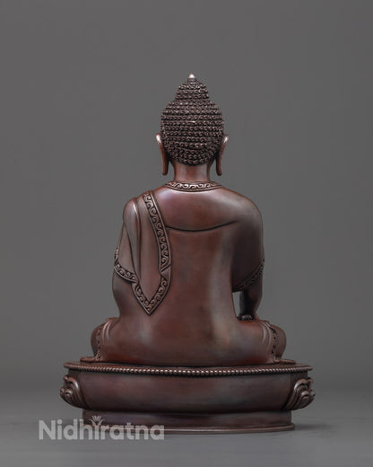 Back view of premium copper oxidized Gautama Buddha statue with intricate details.