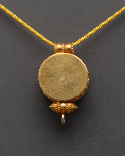 Back view of premium gold-gilded Bumpa Tibetan Locket by master artisans from Patan

