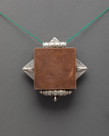 Back view of pure silver lotus locket handcrafted in Nepal for mindfulness and protection