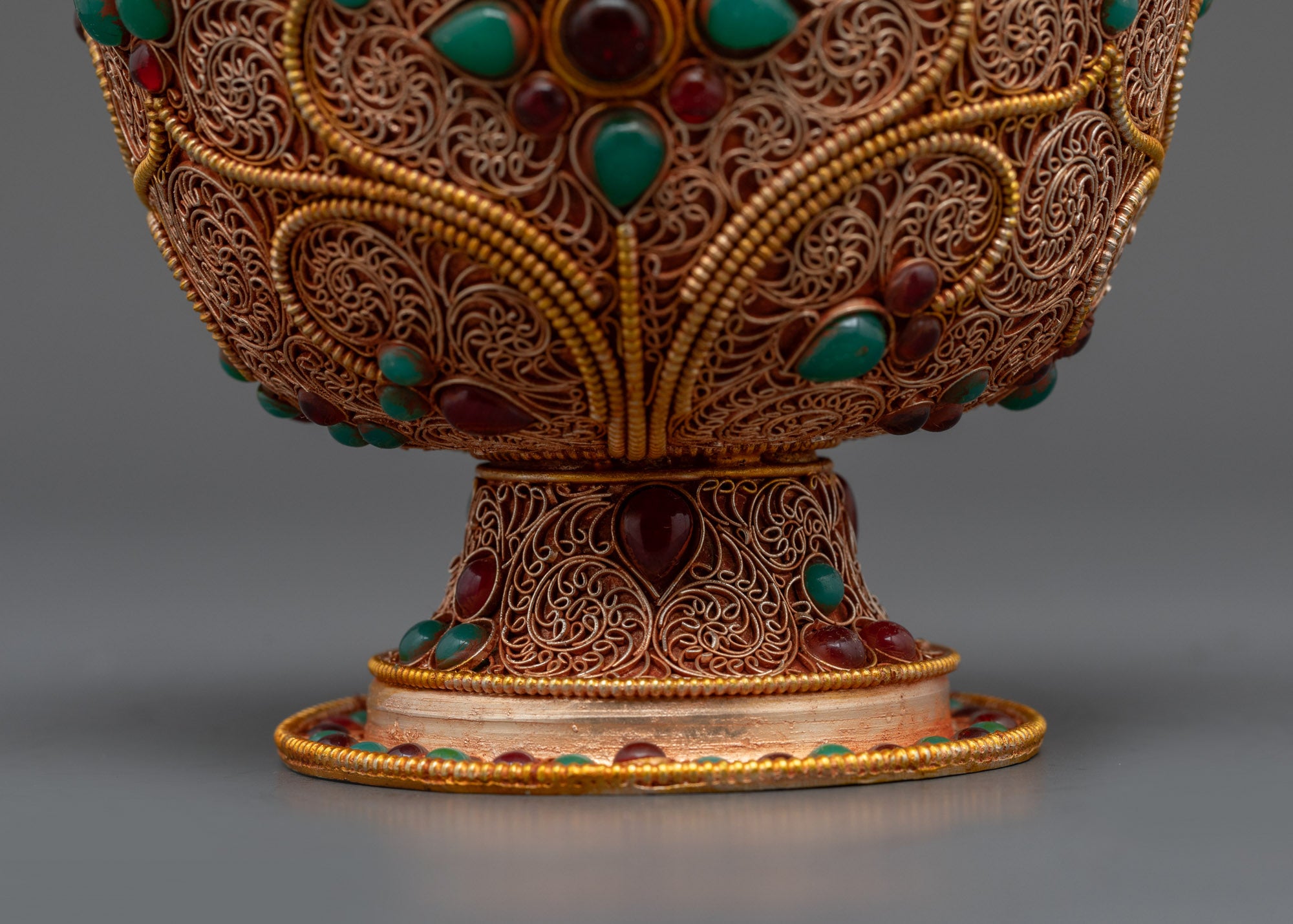 Back view of seven-piece Tibetan Water Offering Bowl collection with filigree details