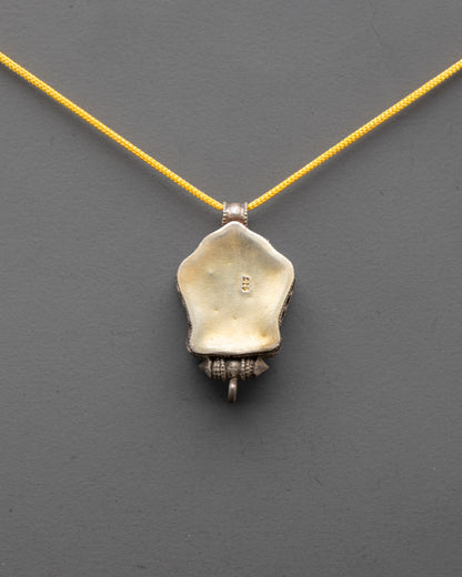 Back view of silver Kalachakra Mantra Pendant showcasing detailed artisan craftsmanship


