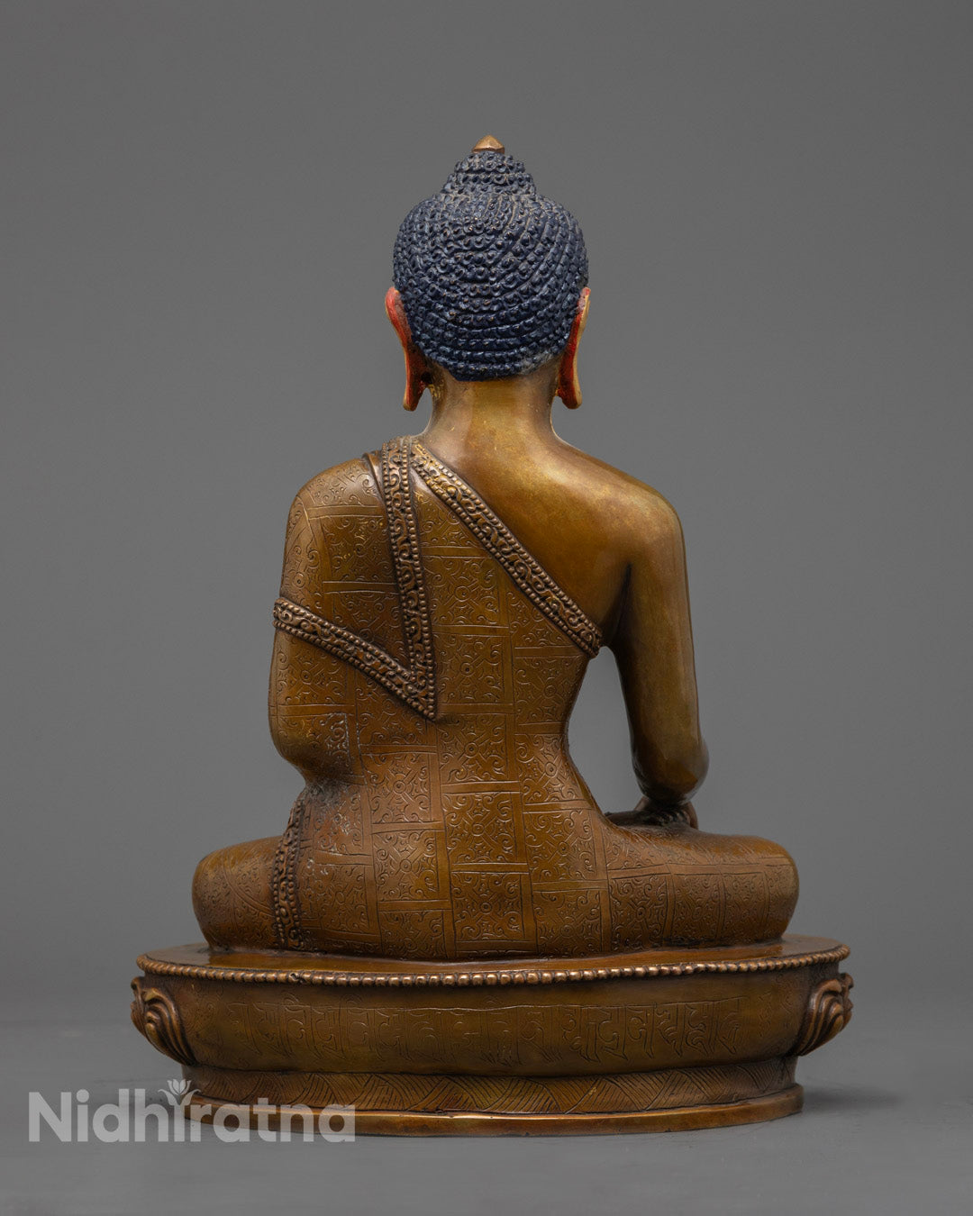 Shakyamuni Buddha sculpture showing intricate details and hollow chamber for mantra placement.
