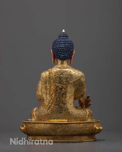 Back view of traditional Medicine Buddha statue with detailed carvings and halo