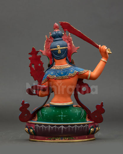Back view of traditional Nepalese Manjushri statue highlighting detailed acrylic painting