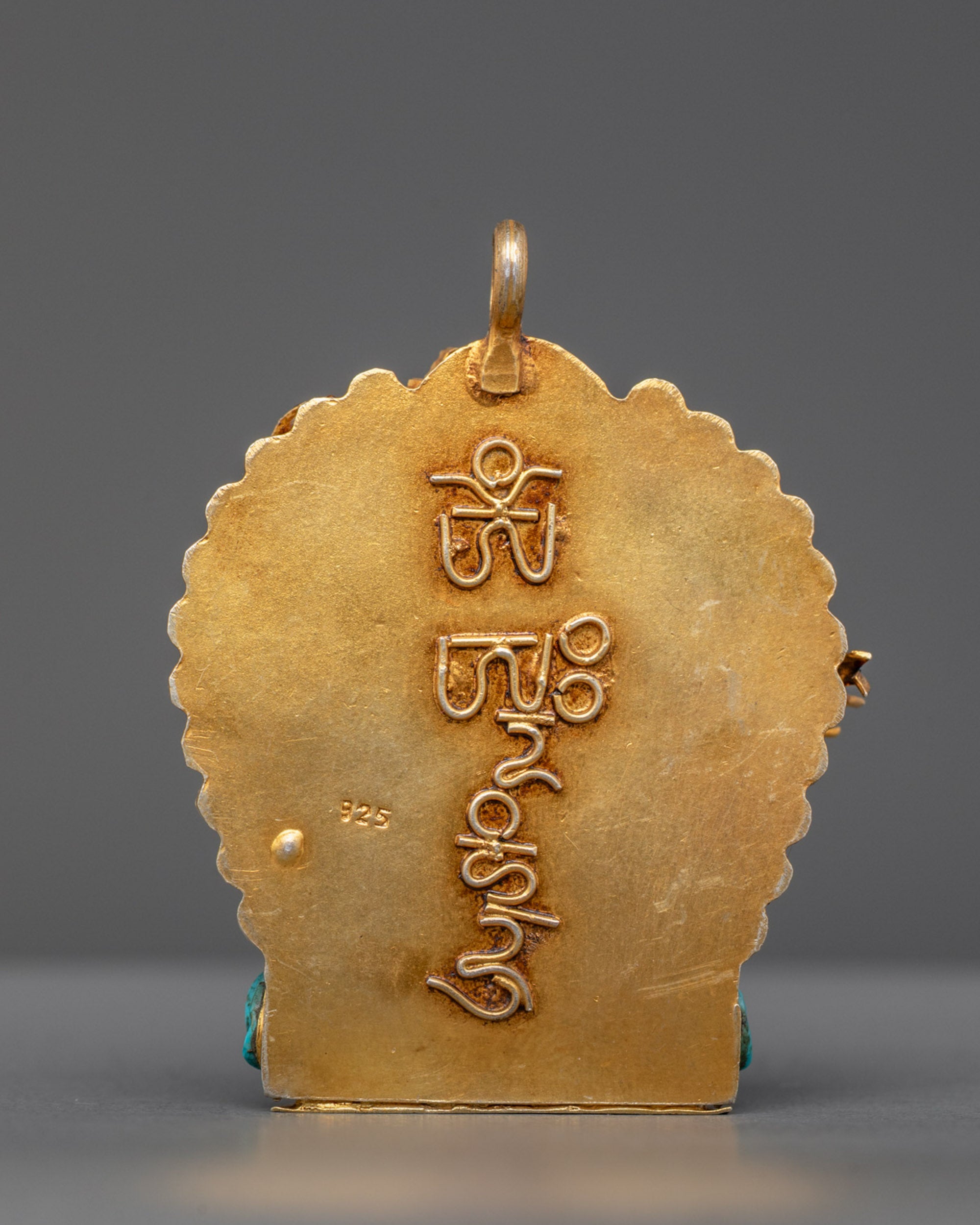 Back view of traditional coral Ganesh amulet with artisan craftsmanship from master artisans
