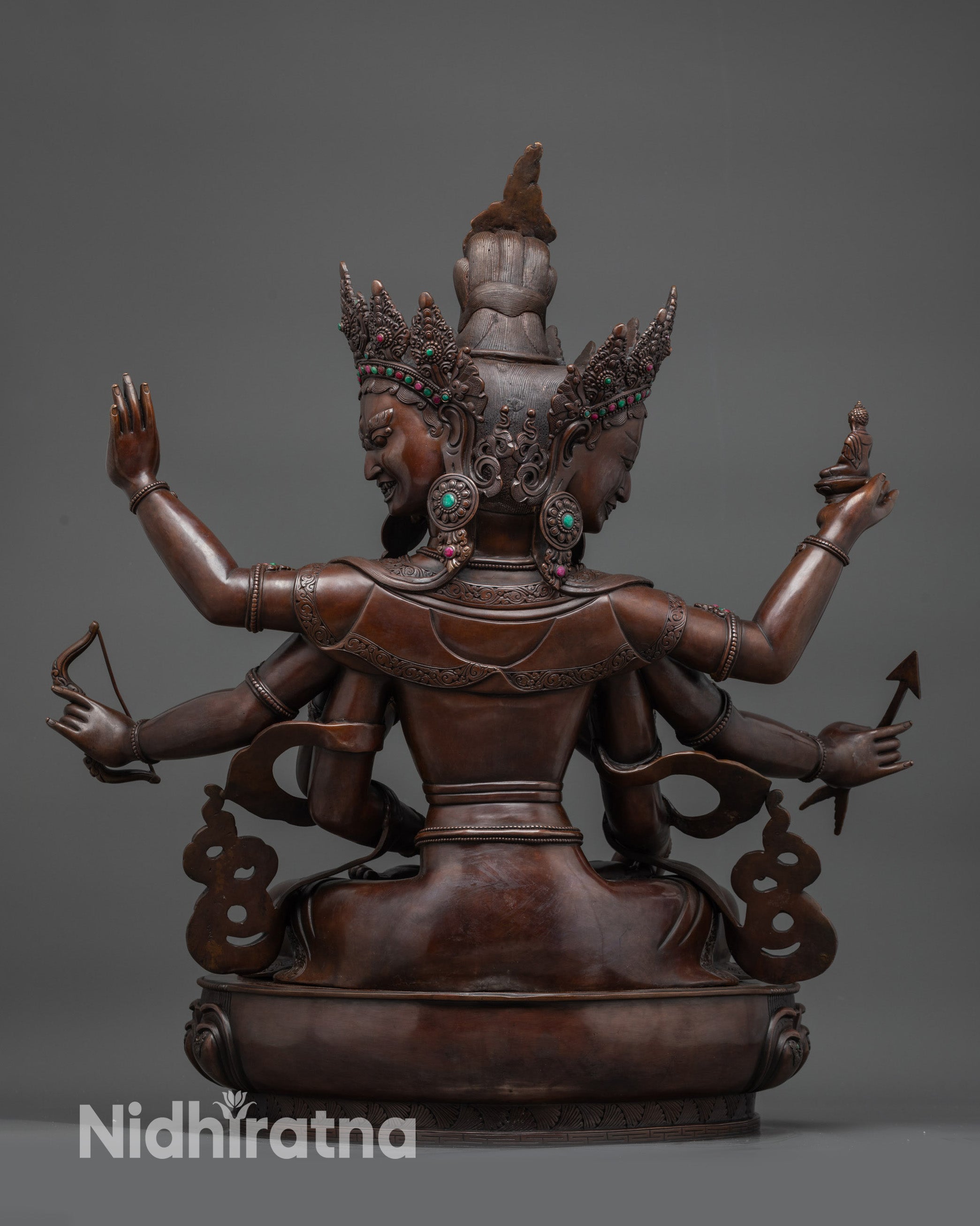 Back view oxidized Namgyalma statue with detailed robes and traditional copper work