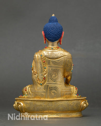 Back view pure gold Buddha statue handmade by Newari artisans with lotus throne and stone accents