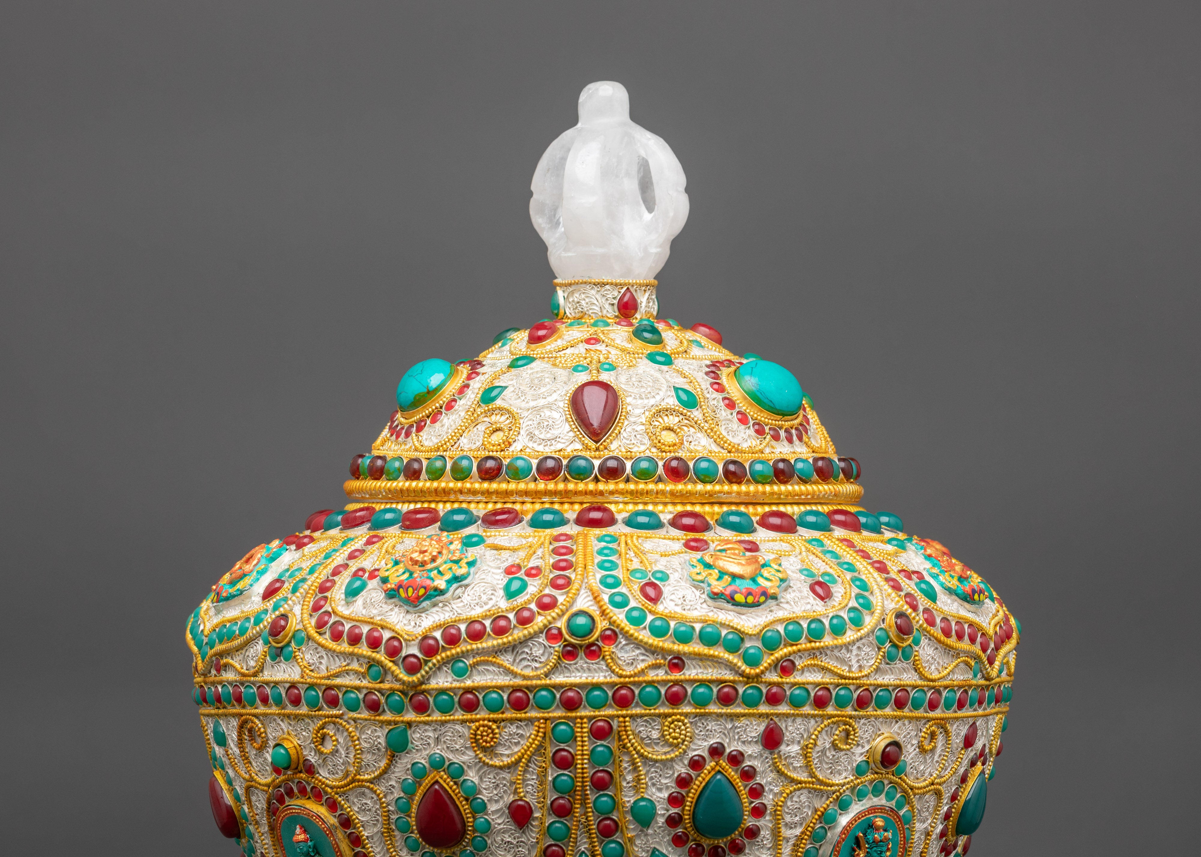 Back view rice pot crowned with crystal half vajra handle and gold turquoise finish