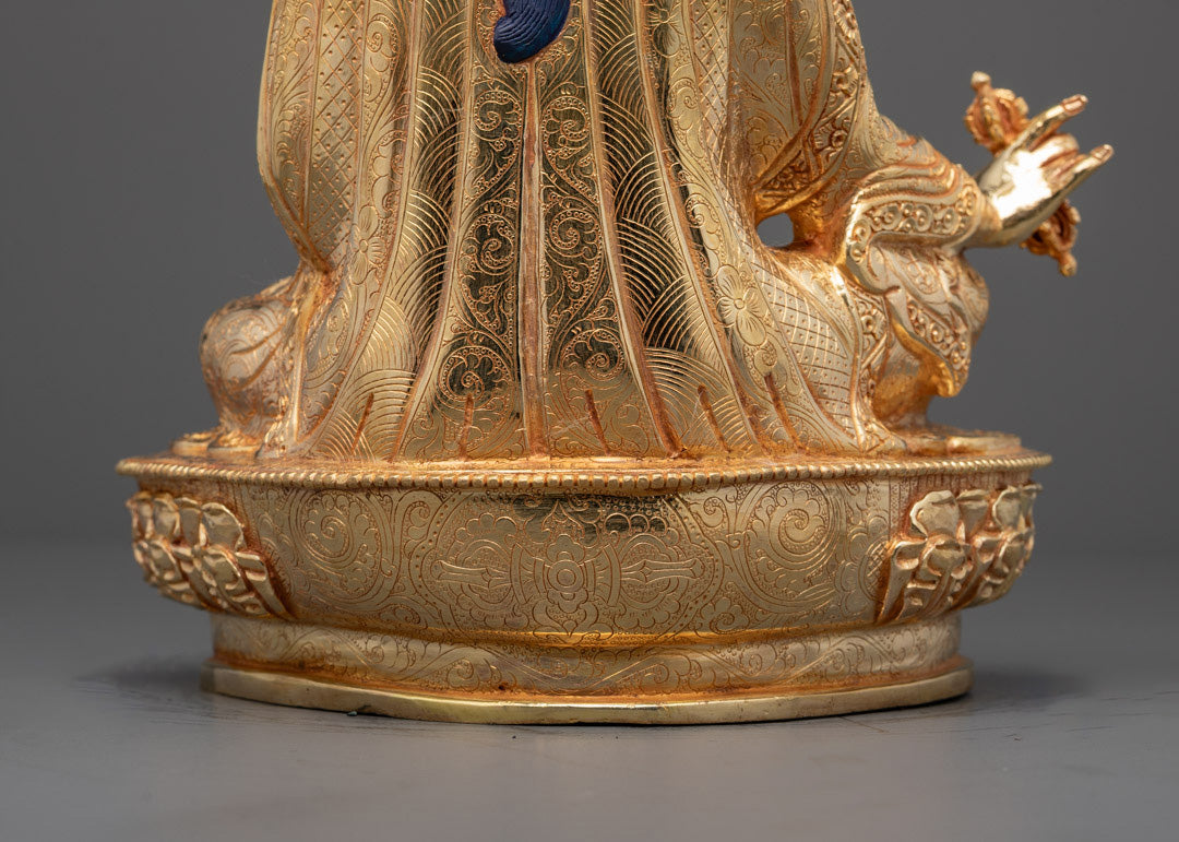 Back view showing detailed carvings on guru’s robe and garments, Himalayan craftsmanship