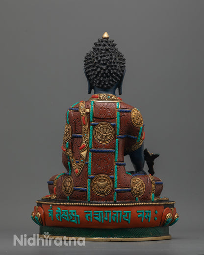 Back view showing engraved sacred mantra and ashtamangala symbols on Medicine Buddha lotus seat