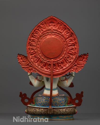 Back view showing the intricate carvings and majestic halo of the copper statue.