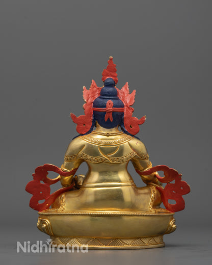Backside of Dzambhala statue showing detailed craftsmanship and consecration chamber design