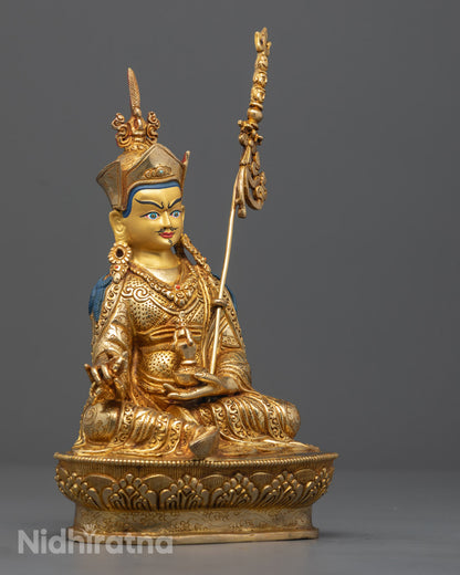 Base of Guru Rinpoche statue featuring mantra-filling hollow section on lotus throne, symbolizing devotion and spiritual practice in Tibetan Buddhism