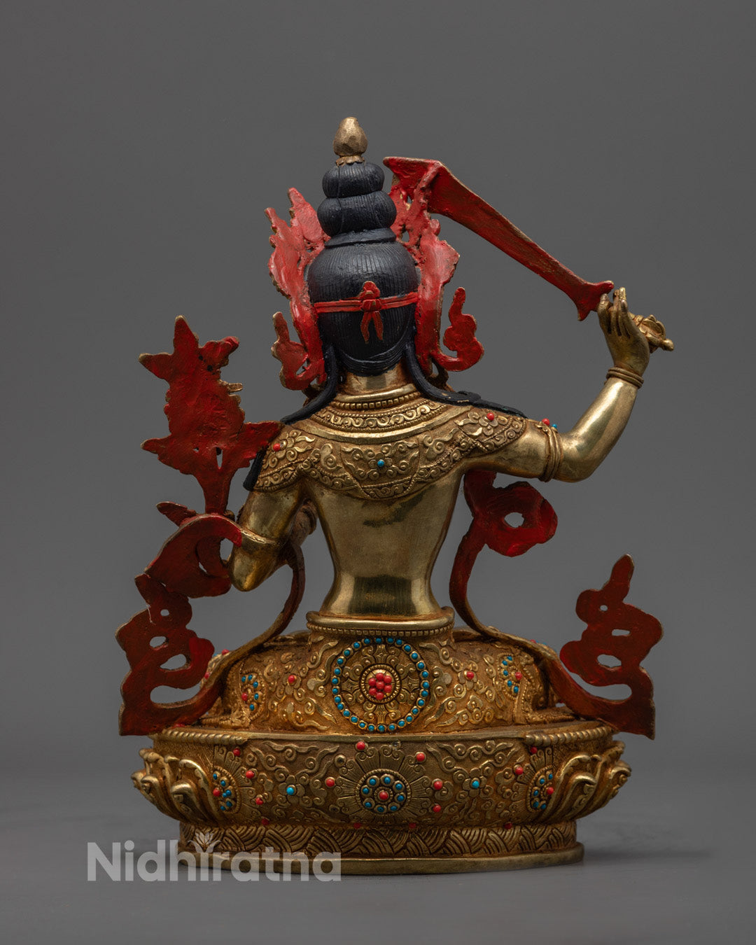 Base of Manjushri statue showing hollow chamber for inserting auspicious mantras or spiritual relics