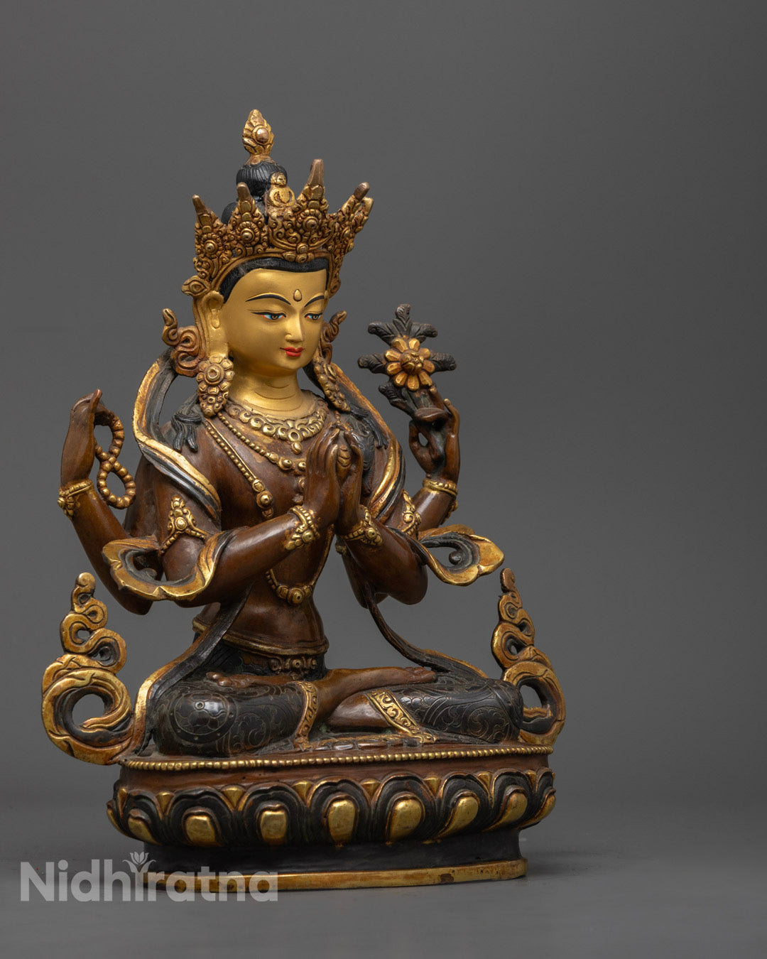 Beautiful Nepalese craftsmanship is shown in a gold-plated Chenrezig statue for meditation and home altar decor.

