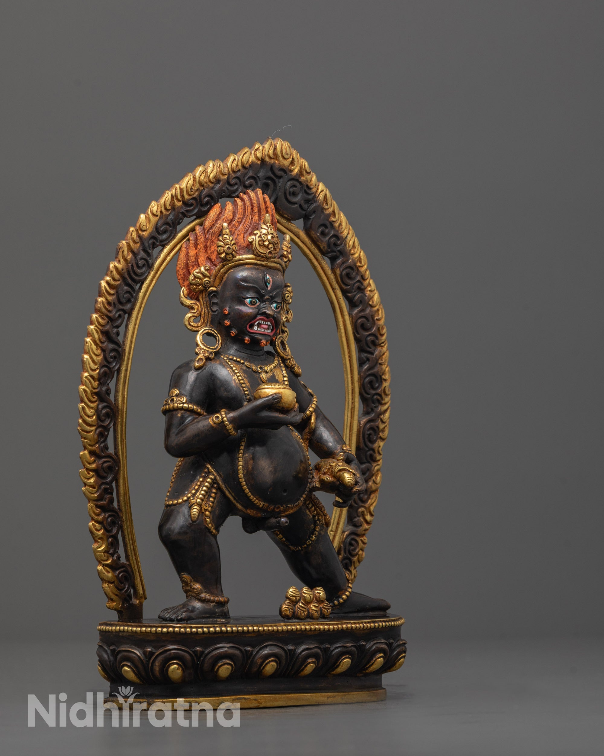 Side view of Premium copper Black Dzambhala statue featuring traditional lost wax craftsmanship