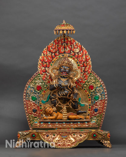Black Dzambhala statue on ornate lotus throne, hand-gilded Nepalese sculpture
