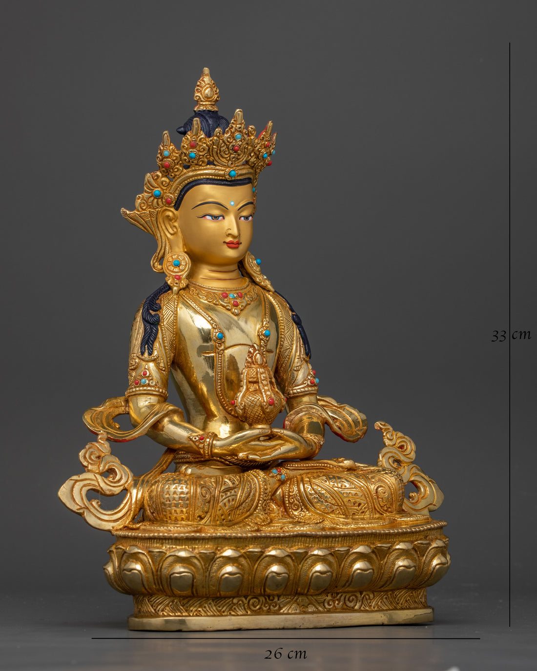 side view of gold coated Bodhisattva Amitayus statue on a copper base