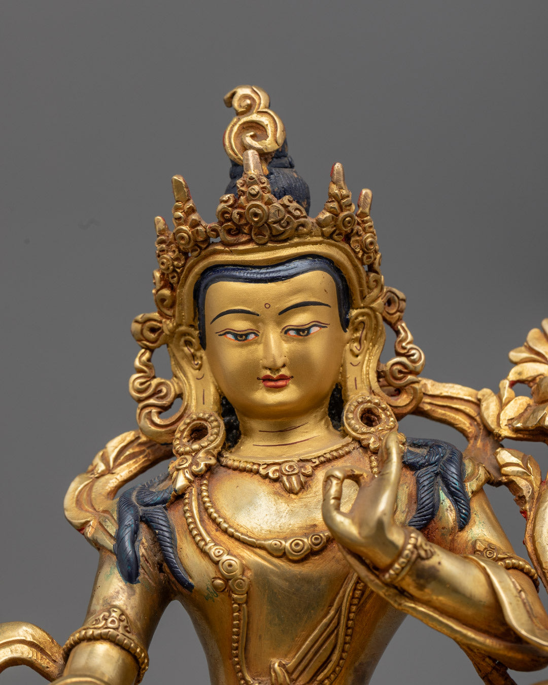 Bodhisattva Sarvanivarana Vishkambhin holding utpala flower and displaying abhaya mudra, seated on lion throne

