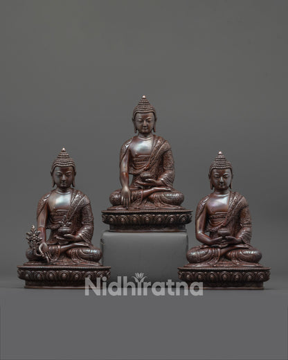 front view of oxidized three buddha set with intricate carved patterns and lotus thrones