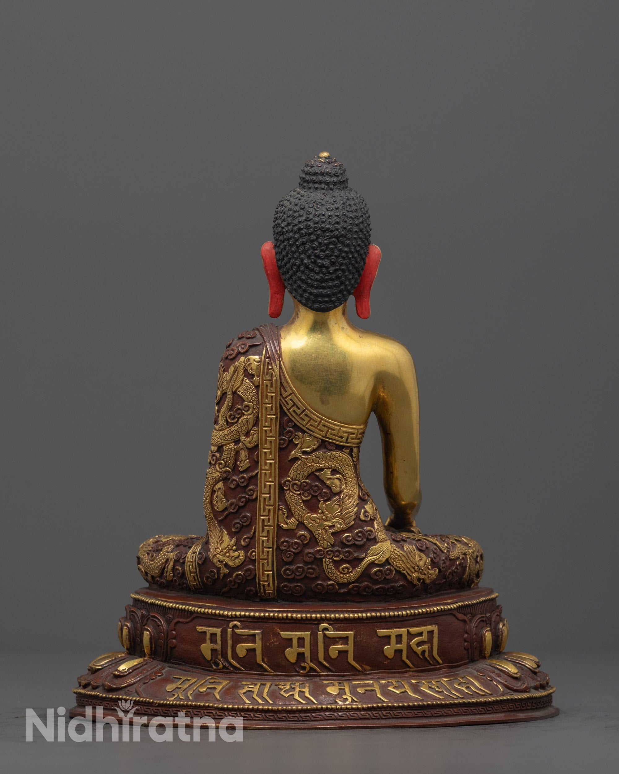 Back view of double-layered lotus seat with hand-carved mantra on Shakyamuni Buddha statue

