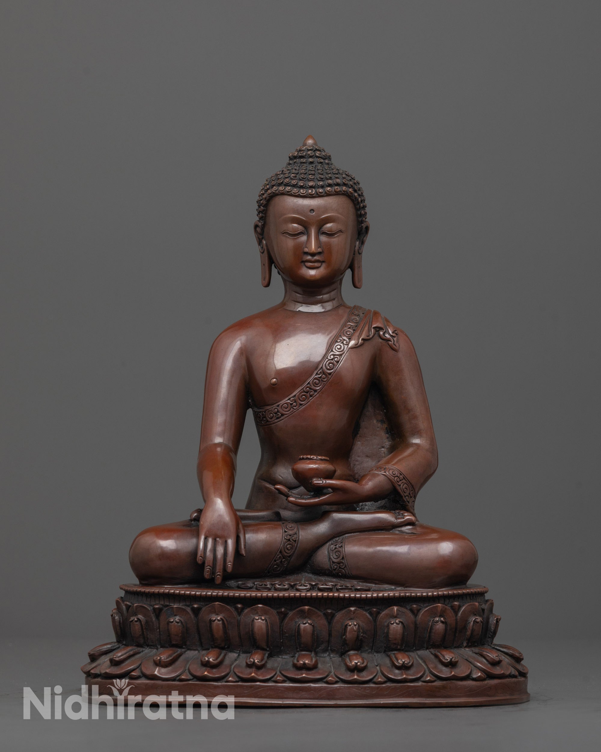 Front view of Sacred Shakyamuni Buddha Sculpture showing monk’s robe and lotus seat details