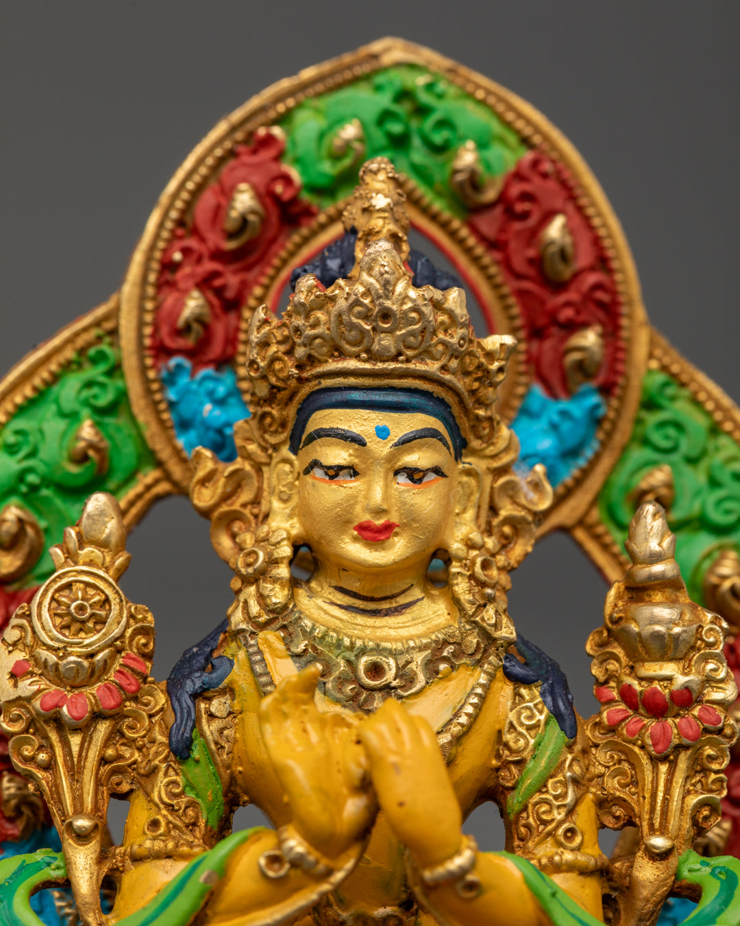 Buddha Maitreya’s delicately hand-painted face and vibrant acrylic halo, representing compassion and the teaching of eternal truth in Mahayana Buddhism.
