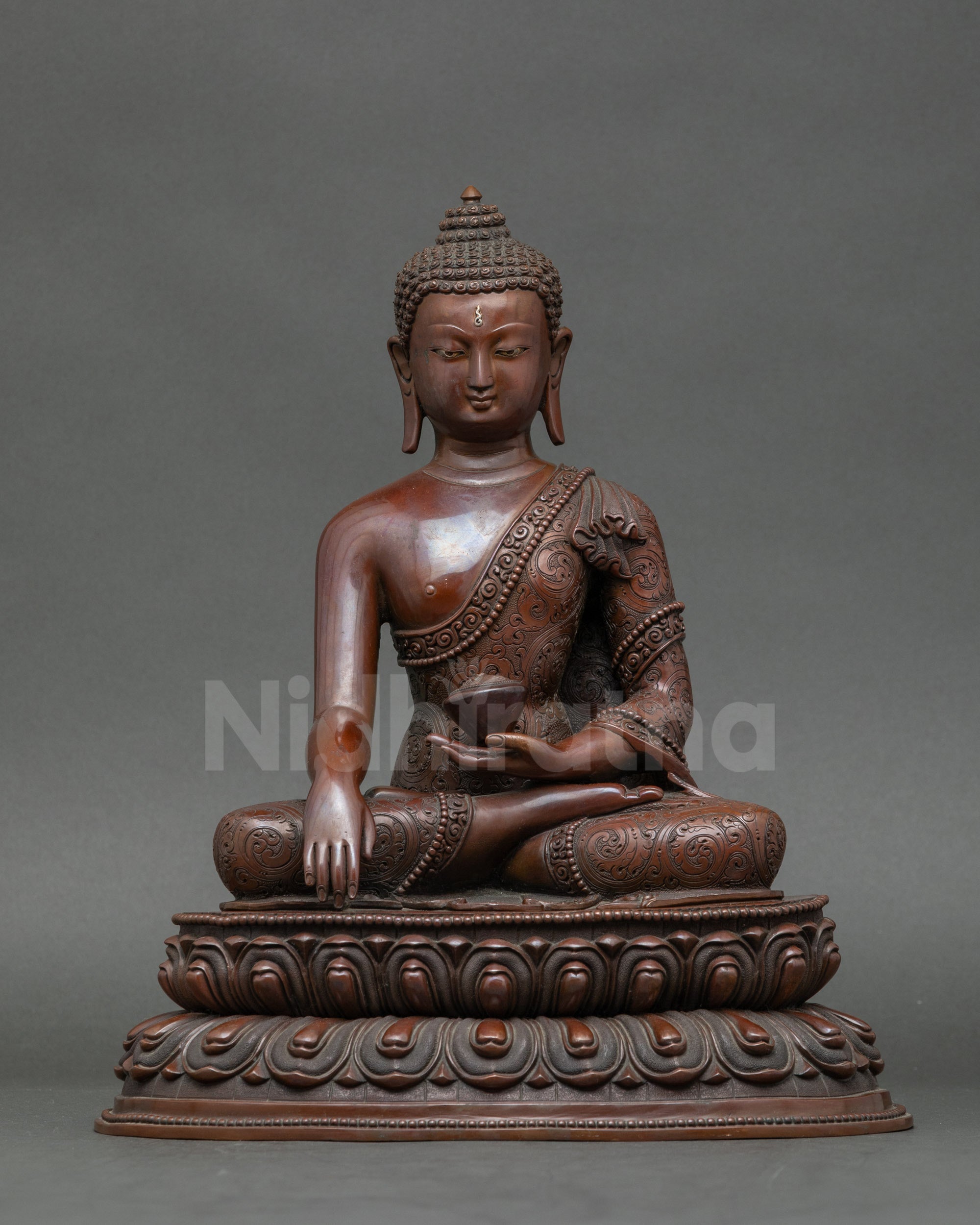 Buddha Shakyamuni statue handcrafted in Patan Nepal, holding monk’s begging bowl