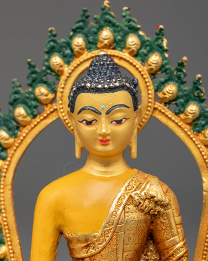 Buddha statue's gold-plated face and hand-painted acrylic halo with intricate detailing