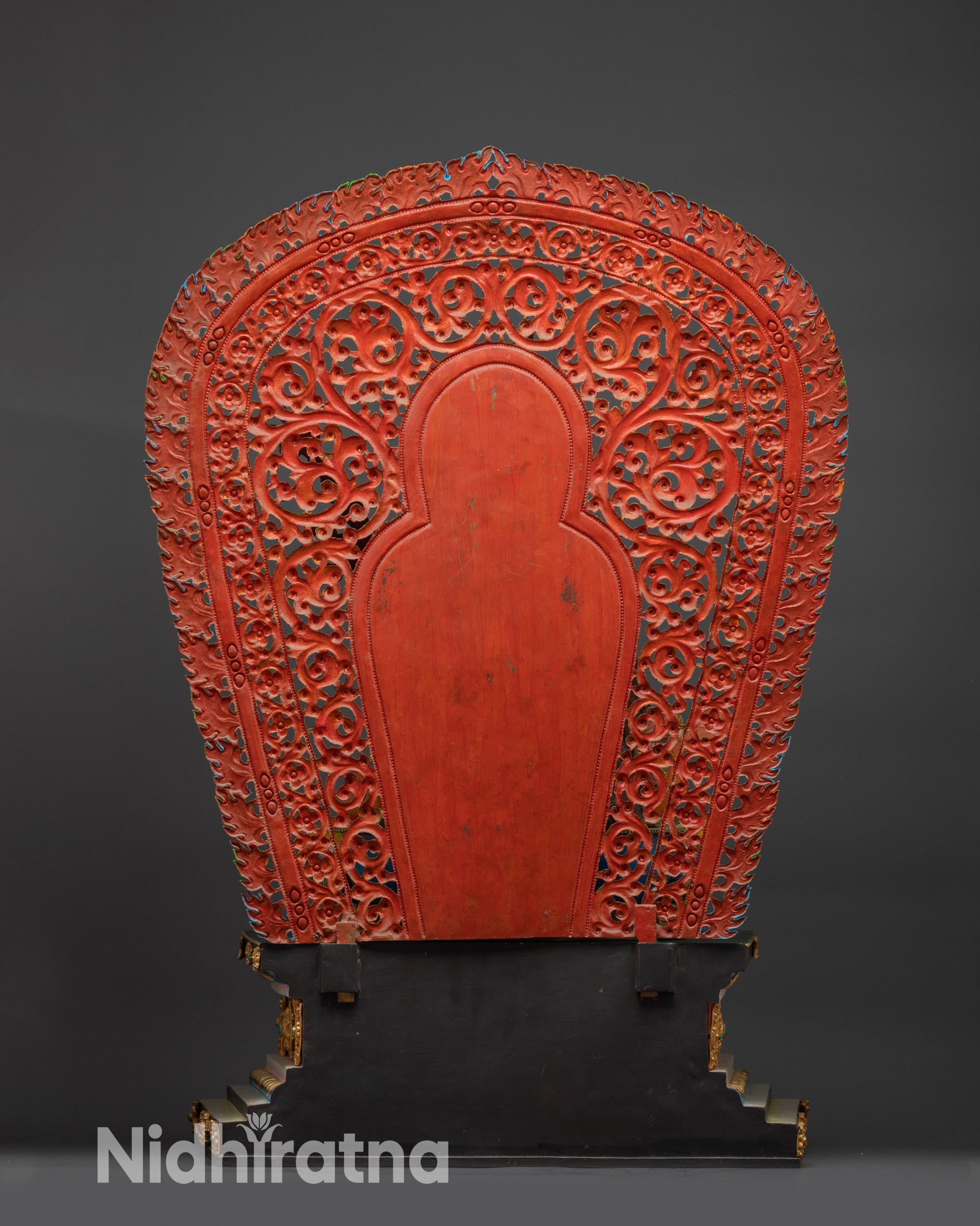Buddhist lion throne back view showing carved copper structure and gold finish
