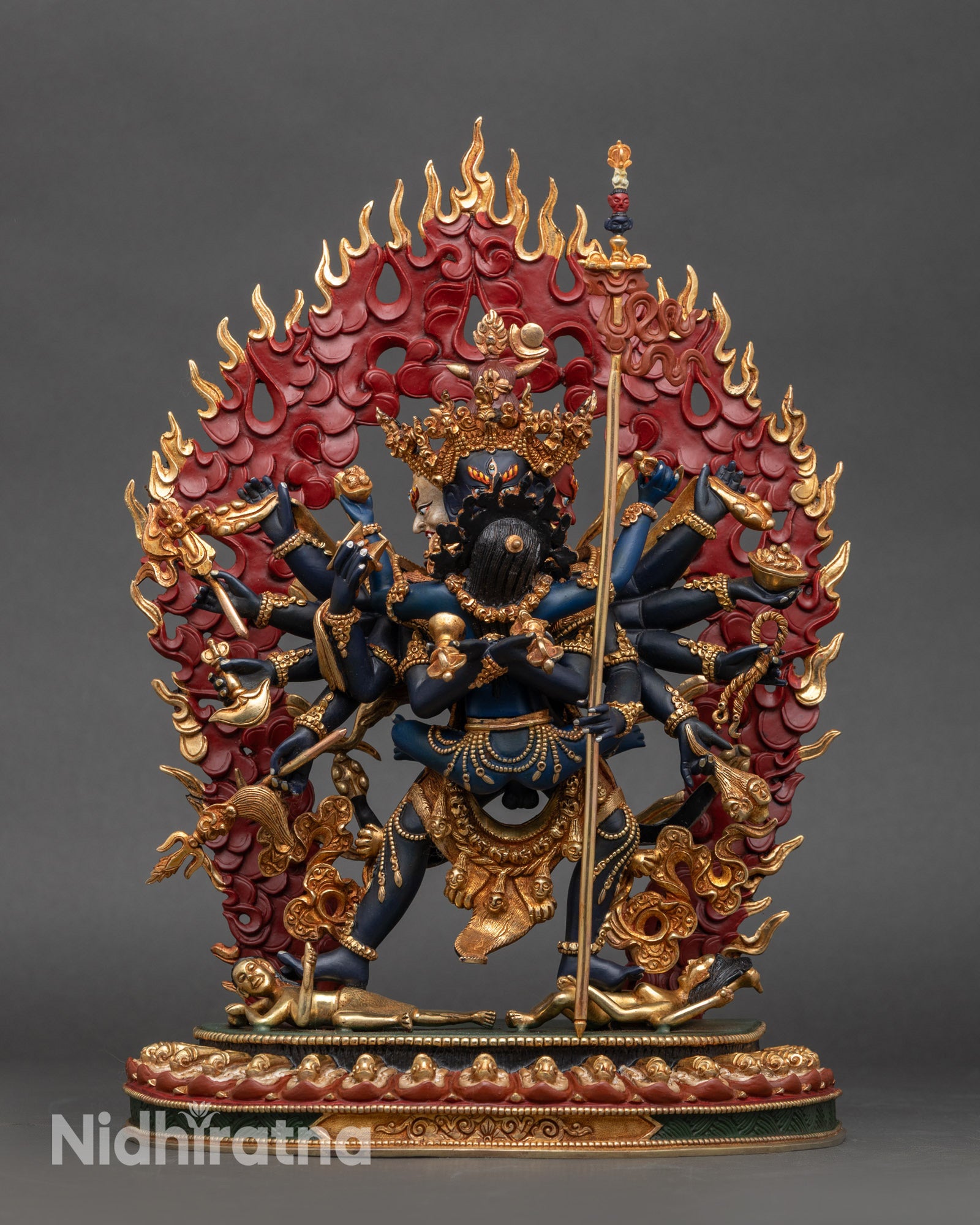 Chakrasamvara Yab Yum statue with consort, twelve arms, lotus base and halo