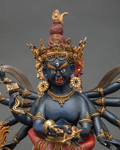Chakrasamvara statue face with four wrathful expressions and gold details