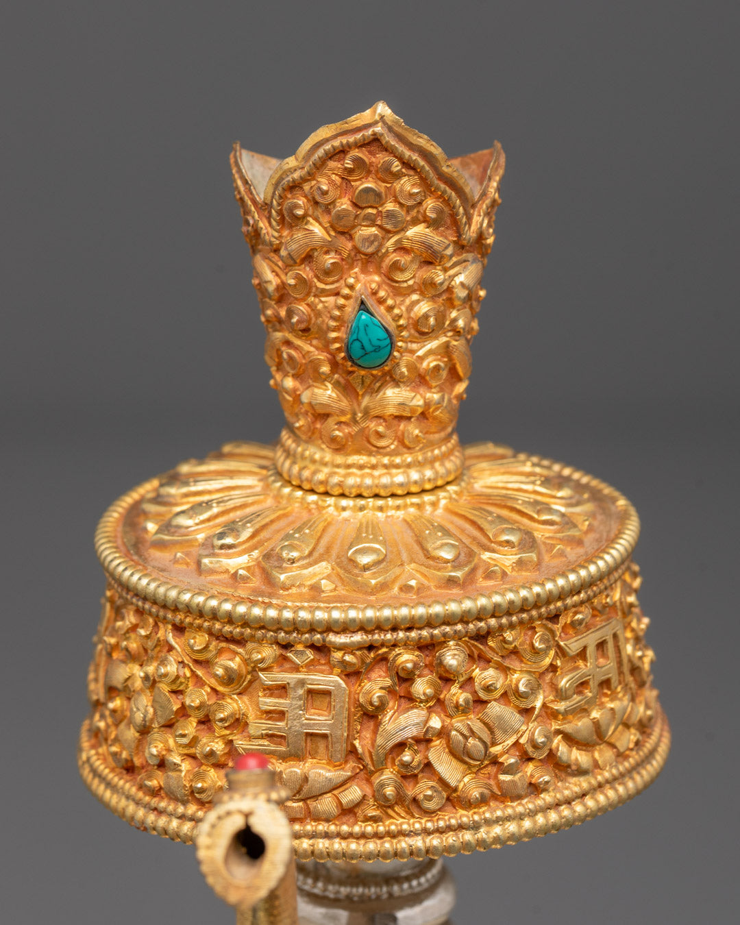 Chegumba statue standing on a decorative base, symbolizing protection