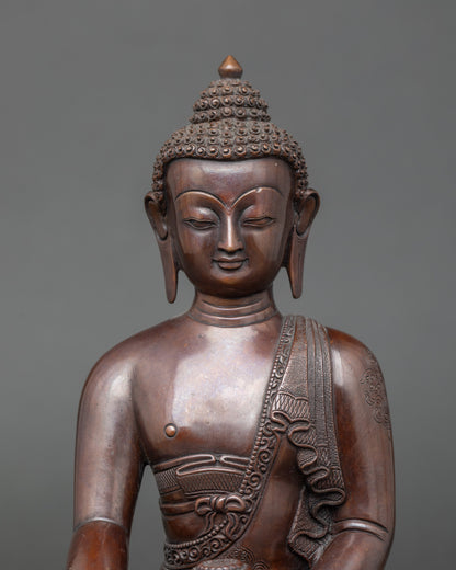 Chemically oxidized Shakyamuni Buddha holding a monk’s alms bowl on lotus throne