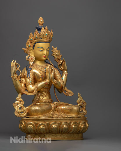 Chenrezig statue holding a wish-fulfilling gem with both hands, mala prayer beads in upper left hand