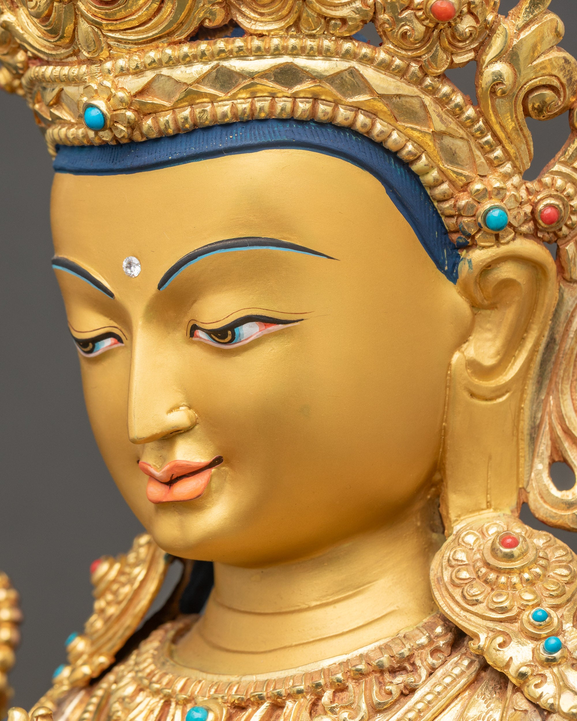 Chenrezig Statue Side Face Close Up Gold-Gilded and Stone Adorned
