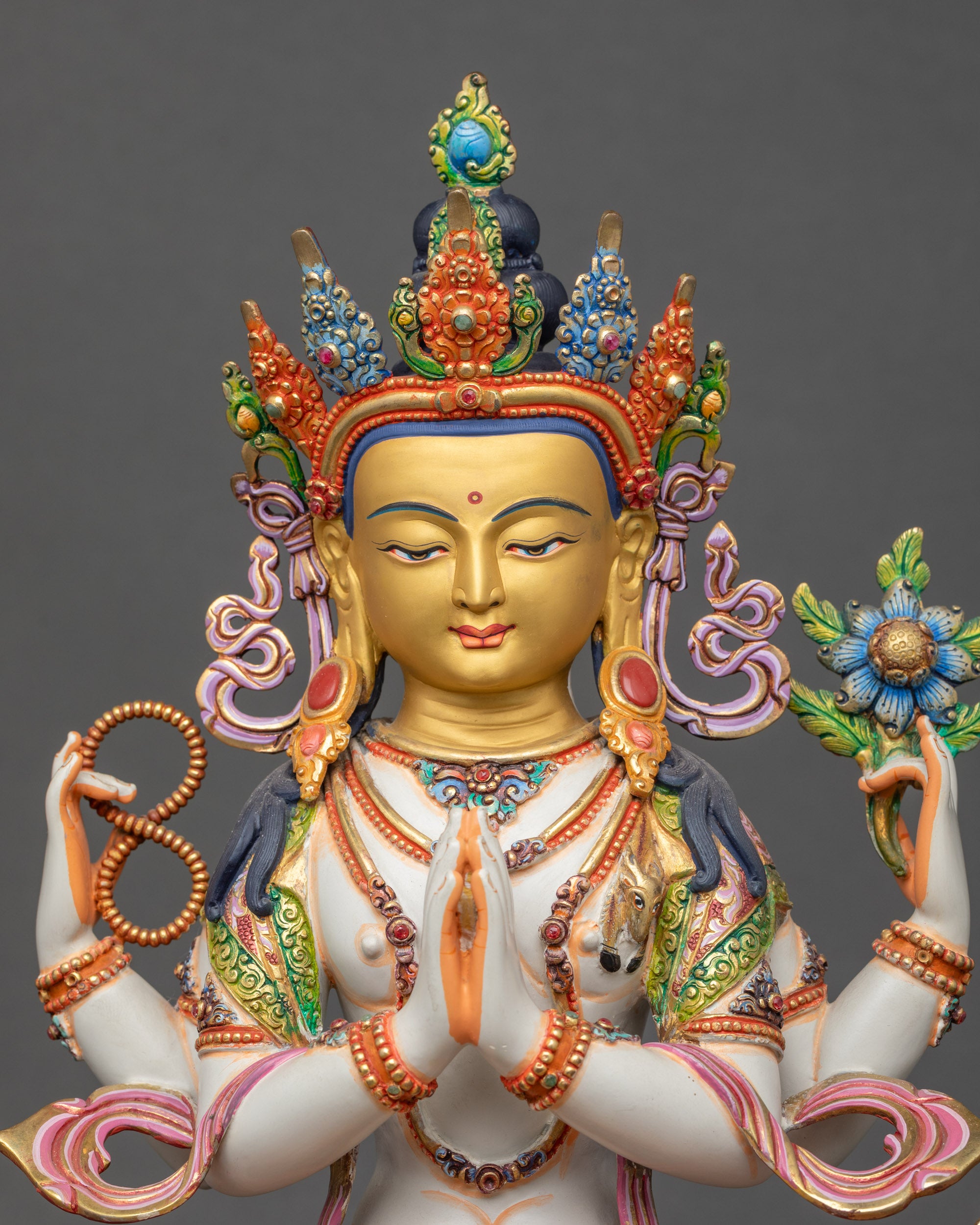 Chenrezig Statue close up showing vibrant copper and acrylic paint details