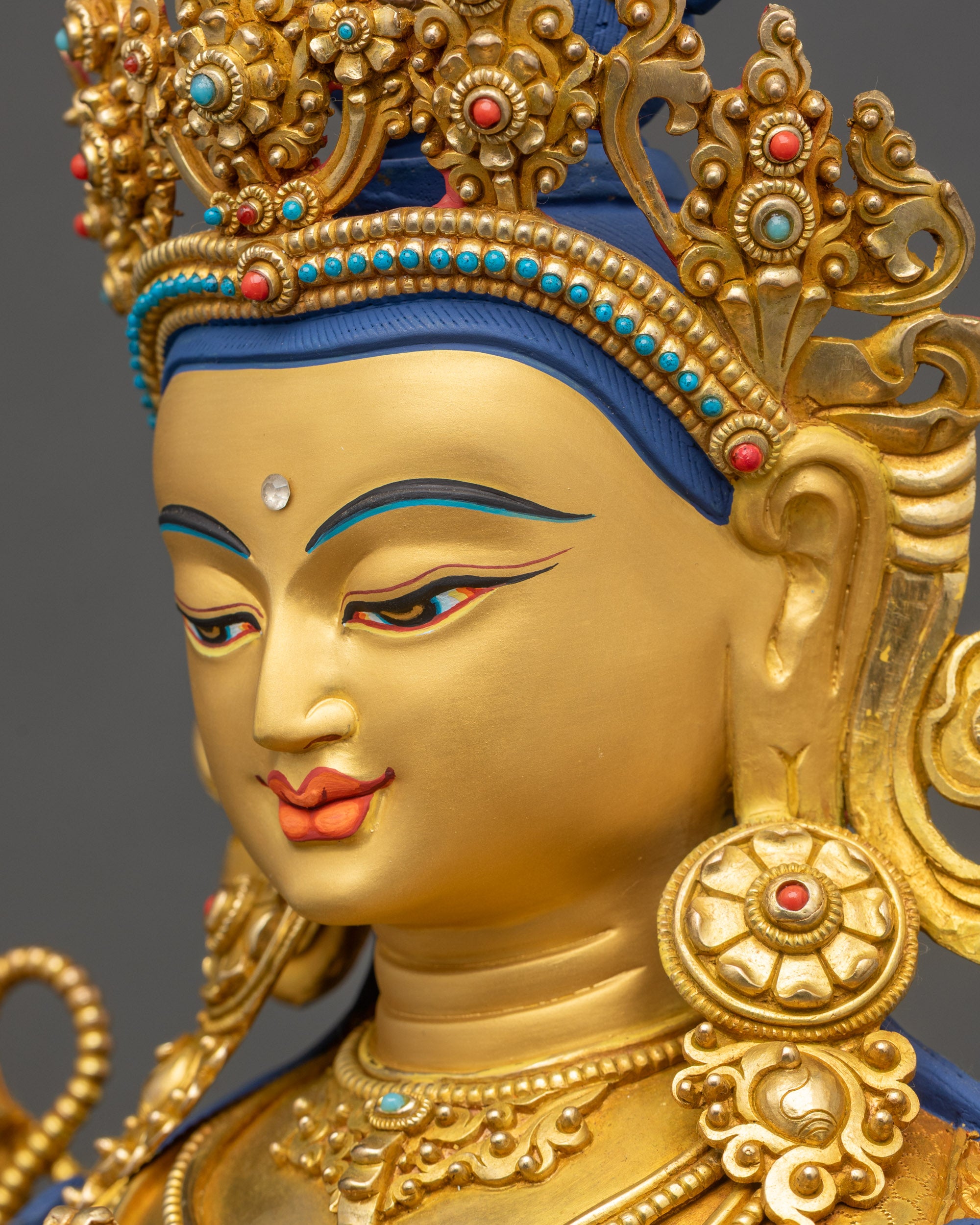 Chenrezig Statue side close up face gold fire-gilded 3D carvings