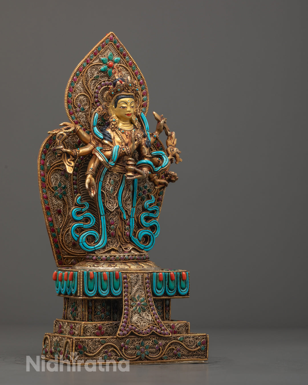 Chenrezig’s floating robe adorned with semi-precious stones, showcasing expert craftsmanship and hand-painted acrylic colors on a 24k gold-gilded body.
